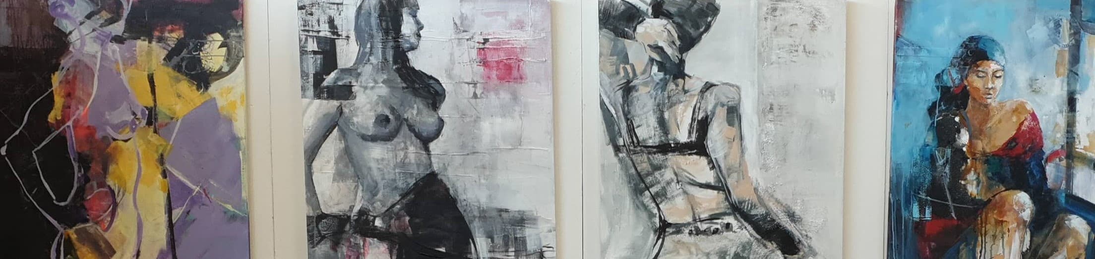 Artworks by Heike Schümann arranged horizontally on a wall.